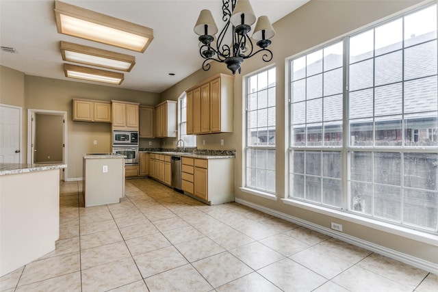 2310 Crest Park Dr, Arlington, TX 76006 - kitchen featuring plenty of natural light, baseboards, appliances with stainless steel finishes, and light tile patterned flooring