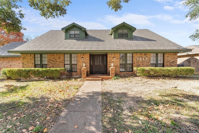 1215 Spring Lake Dr, Duncanville, TX 75137 - cape cod-style house featuring brick siding