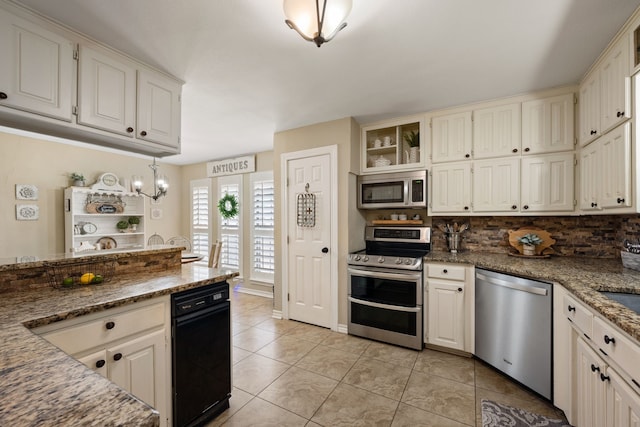 kitchen with light tile patterned floors, white cabinets, stone counters, appliances with stainless steel finishes, and backsplash