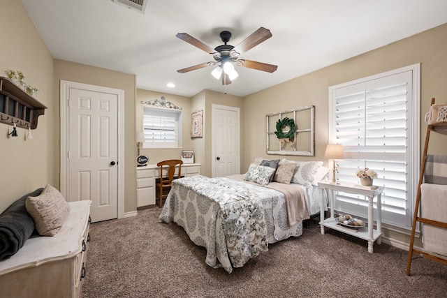 bedroom featuring carpet floors, a ceiling fan, baseboards, and visible vents