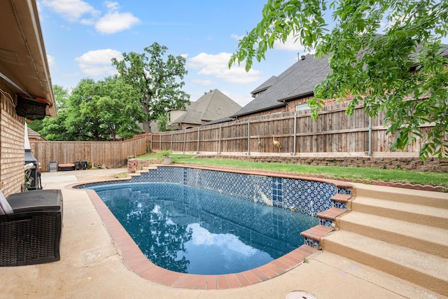 view of swimming pool featuring a patio, a fenced in pool, and a fenced backyard