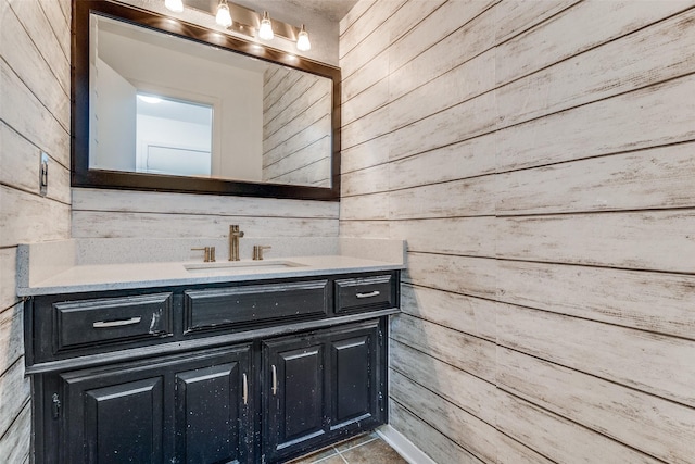 10119 Chisholm Trl, Dallas, TX 75243 - bathroom featuring wooden walls and vanity