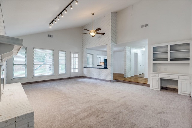 10119 Chisholm Trl, Dallas, TX 75243 - unfurnished living room with light carpet, ceiling fan, high vaulted ceiling, and baseboards