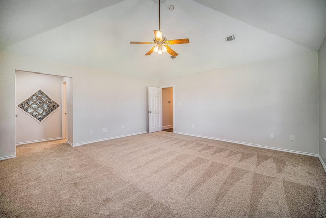 unfurnished room with ceiling fan, visible vents, carpet, and lofted ceiling
