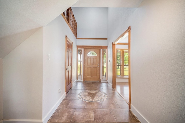 entryway featuring baseboards