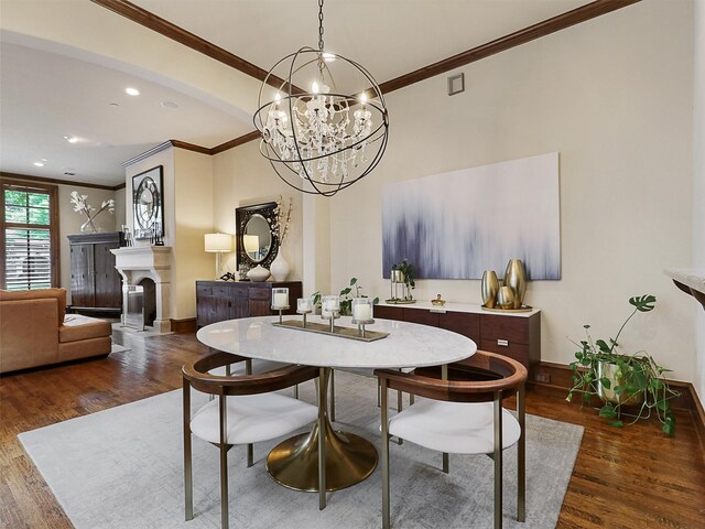 living area featuring stairs, arched walkways, crown molding, and wood finished floors