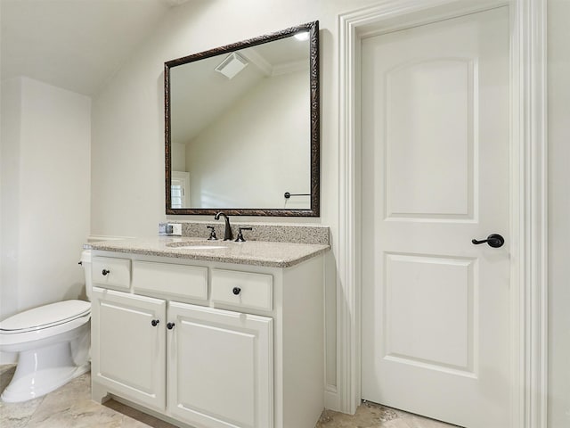 bathroom featuring vanity, lofted ceiling, visible vents, and toilet