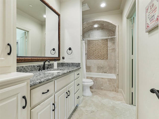 full bathroom with crown molding, vanity, tiled shower / bath, and toilet