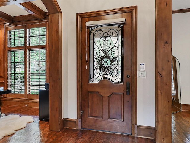 entrance foyer featuring baseboards, dark wood-style flooring, and beamed ceiling