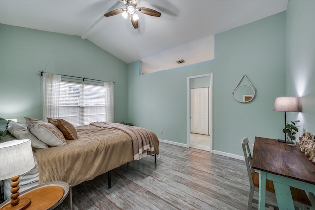 bedroom with ceiling fan, visible vents, light wood-type flooring, baseboards, and lofted ceiling with beams