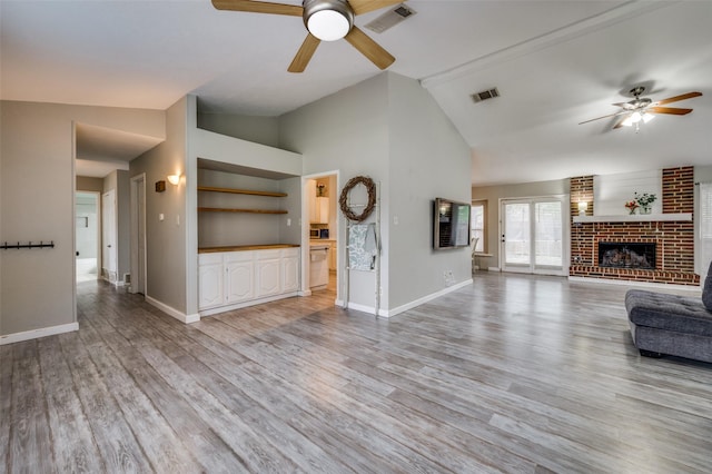 unfurnished living room with baseboards, ceiling fan, and visible vents