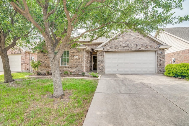 924 Bowie Dr, Lavon, TX 75166 - view of front of property with an attached garage, driveway, brick siding, and a front lawn