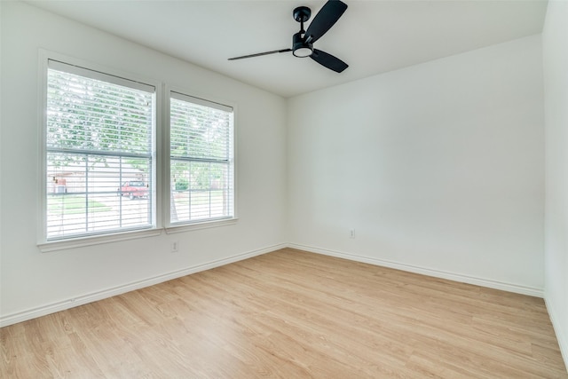 924 Bowie Dr, Lavon, TX 75166 - unfurnished room with plenty of natural light, wood finished floors, and a ceiling fan
