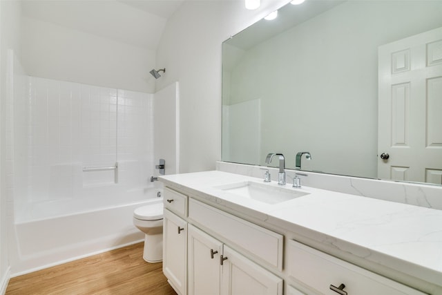 924 Bowie Dr, Lavon, TX 75166 - bathroom featuring wood finished floors, toilet, vanity, and shower / washtub combination