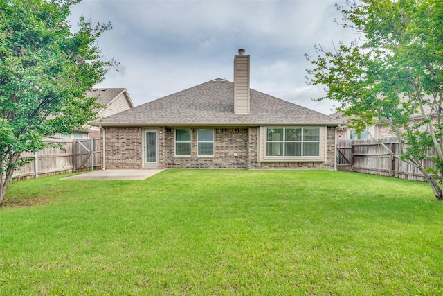 924 Bowie Dr, Lavon, TX 75166 - rear view of house featuring a patio area, a chimney, brick siding, and roof with shingles