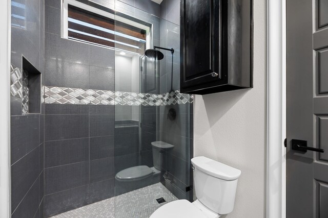 1002 Tokala St, Caddo Mills, TX 75135 - bathroom featuring toilet and tiled shower