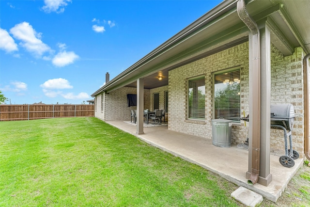 view of yard with fence and a patio area