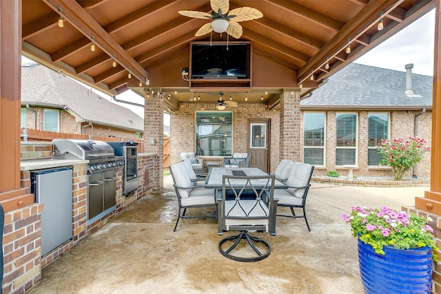 view of patio / terrace featuring outdoor dining area, area for grilling, and ceiling fan