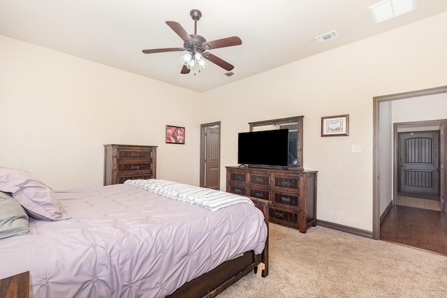 bedroom with baseboards, ceiling fan, visible vents, and light colored carpet