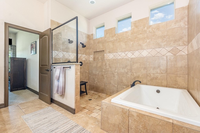 full bath with a garden tub, tile patterned flooring, and a walk in shower