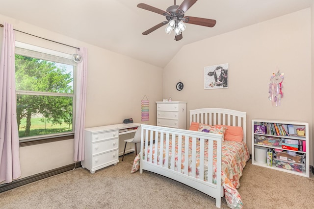 bedroom featuring a ceiling fan, light colored carpet, and vaulted ceiling