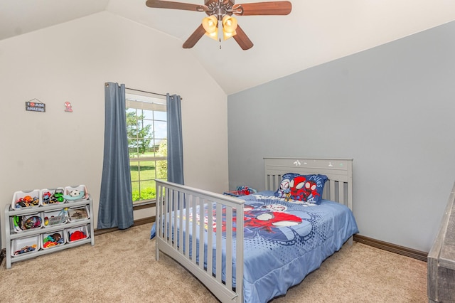 carpeted bedroom featuring baseboards, ceiling fan, and vaulted ceiling