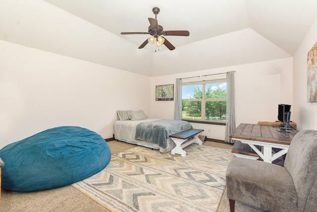 bedroom with vaulted ceiling, ceiling fan, carpet, and baseboards