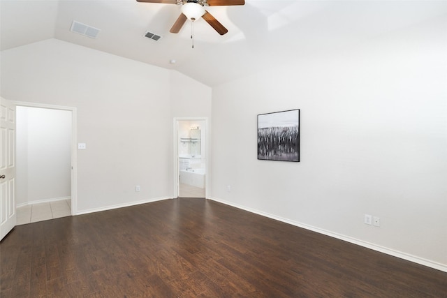 unfurnished room with visible vents, a ceiling fan, lofted ceiling, and wood finished floors