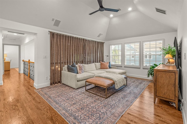 living area with a ceiling fan, visible vents, wood finished floors, baseboards, and recessed lighting