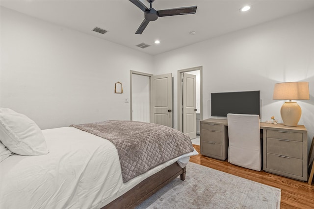 bedroom featuring light wood-style floors, a ceiling fan, recessed lighting, and visible vents