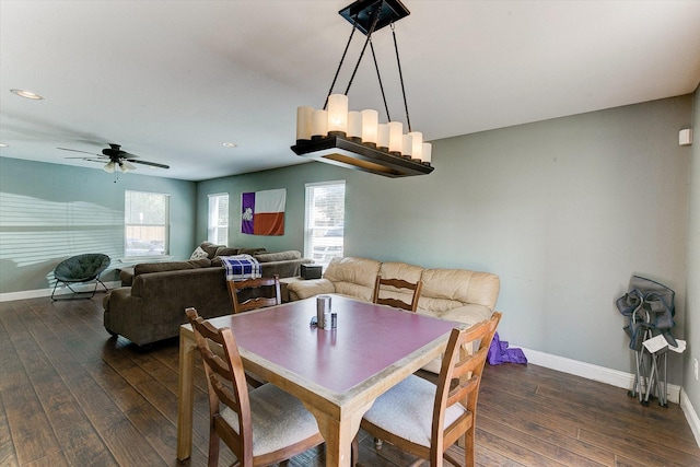 dining area with baseboards, dark wood finished floors, and ceiling fan