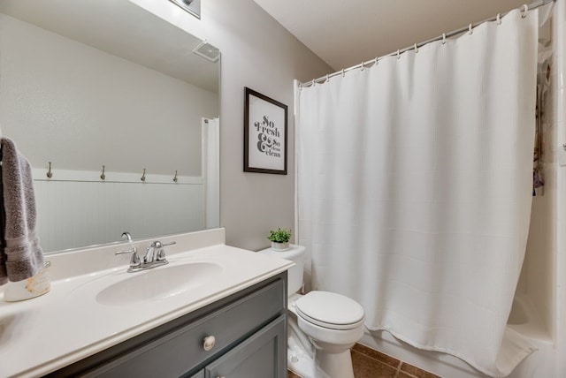 full bathroom featuring vanity, tile patterned floors, toilet, and shower / tub combo