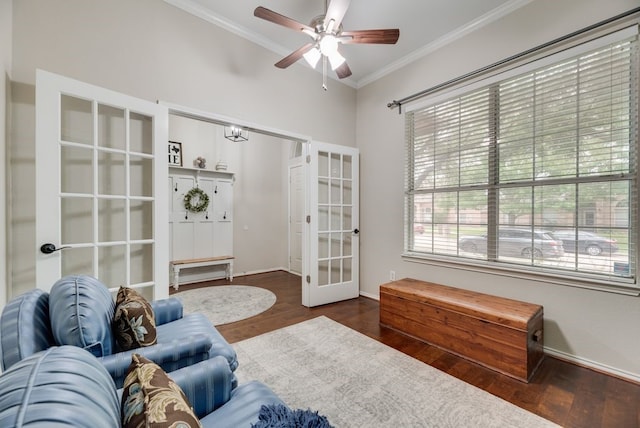 living area featuring french doors, ornamental molding, a wealth of natural light, and wood finished floors