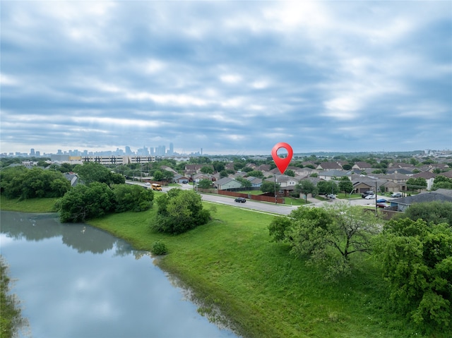 bird's eye view featuring a water view and a city view