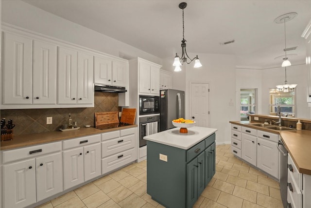 kitchen with visible vents, a sink, white cabinets, black appliances, and a chandelier