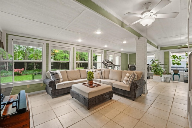 tiled living area with ornate columns, recessed lighting, and a ceiling fan