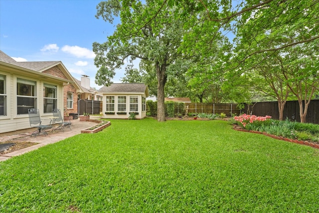view of yard with a fenced backyard and a patio