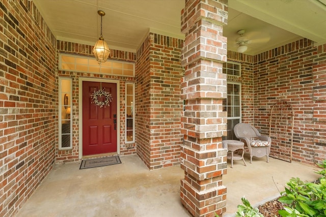 property entrance featuring brick siding