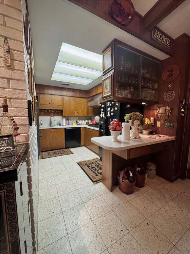 bar featuring a sink, light floors, black dishwasher, and exhaust hood