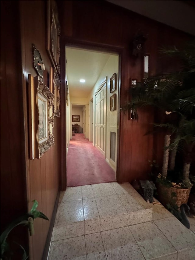 hall featuring baseboards