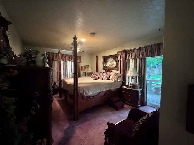 bedroom with carpet flooring, a textured ceiling, ceiling fan, and multiple windows