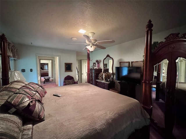 bedroom featuring a ceiling fan and a textured ceiling