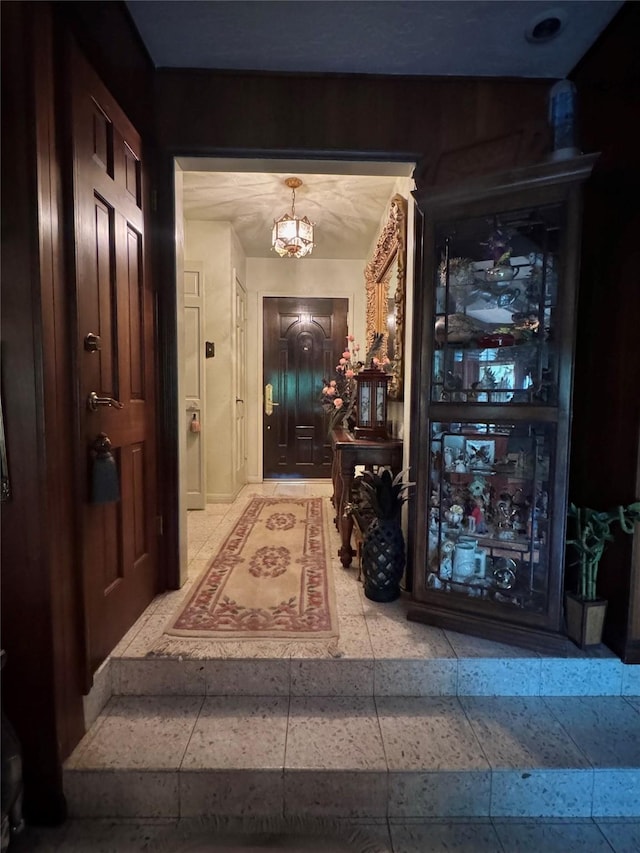hall with a chandelier