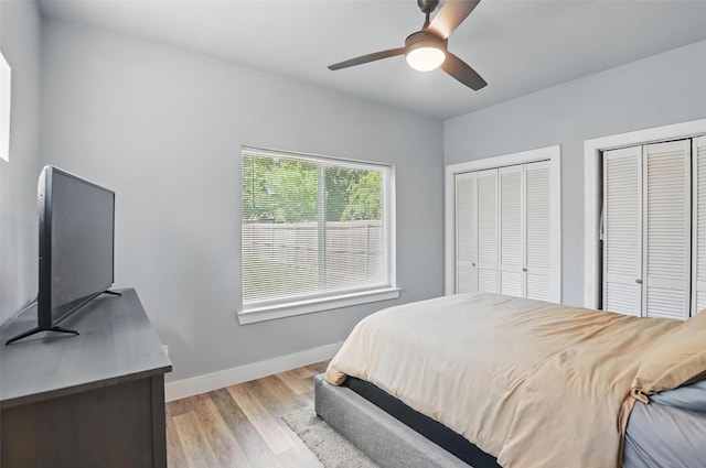 1933 Shaw St, Dallas, TX 75212 - bedroom featuring light wood-style floors, multiple closets, ceiling fan, and baseboards