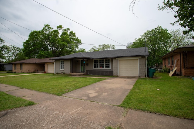 ranch-style house with a garage, concrete driveway, a front lawn, and brick siding