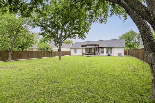 back of house with a patio, a fenced backyard, a yard, and a pergola