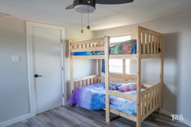 bedroom featuring a ceiling fan and wood finished floors