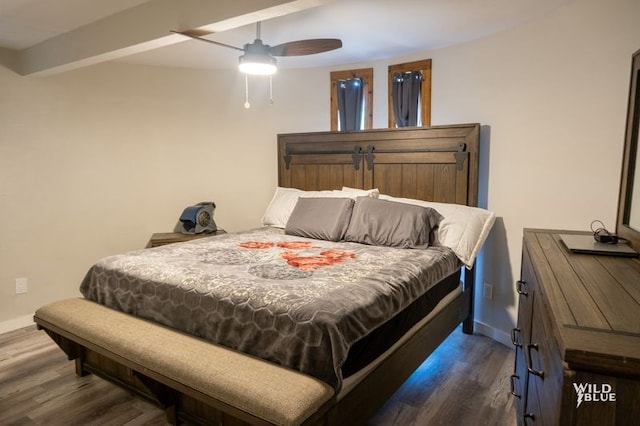bedroom featuring a ceiling fan, baseboards, and dark wood-style floors