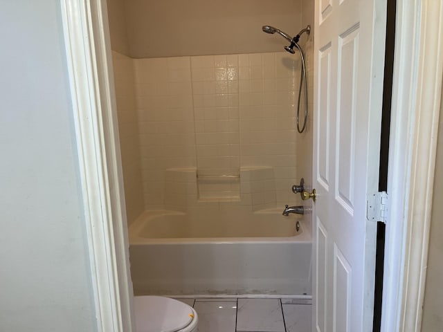 bathroom with toilet and tub / shower combination