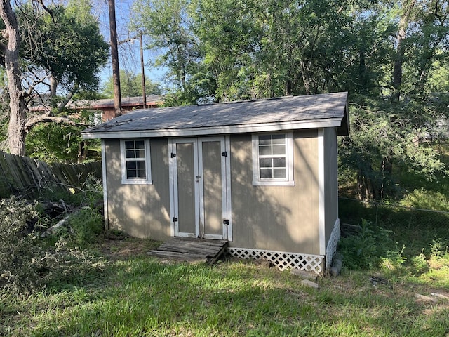 view of shed featuring a fenced backyard